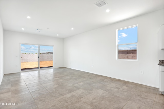 spare room featuring plenty of natural light