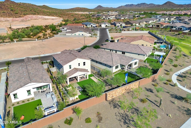 drone / aerial view featuring a residential view and a mountain view