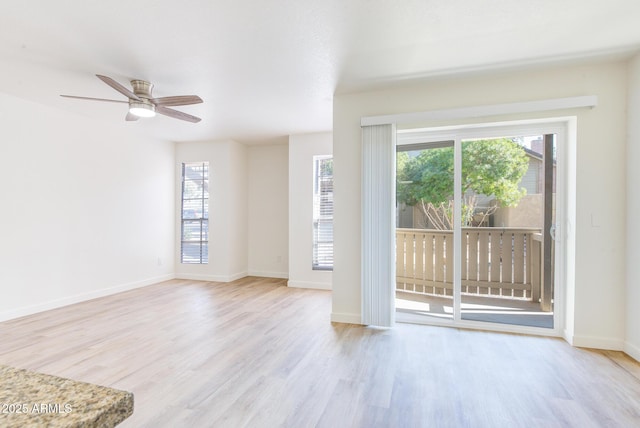 unfurnished living room featuring ceiling fan and light hardwood / wood-style flooring