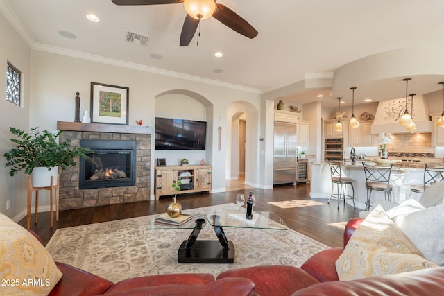 1617 E Copper Holw, Queen Creek, AZ 85140 - living room featuring dark wood-style flooring, a ceiling fan, ornamental molding, baseboards, and recessed lighting