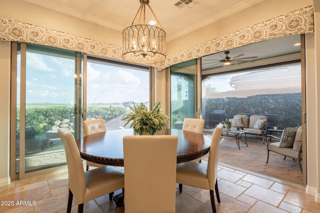 1617 E Copper Holw, Queen Creek, AZ 85140 - dining space with stone tile floors, ornamental molding, a ceiling fan, and a chandelier