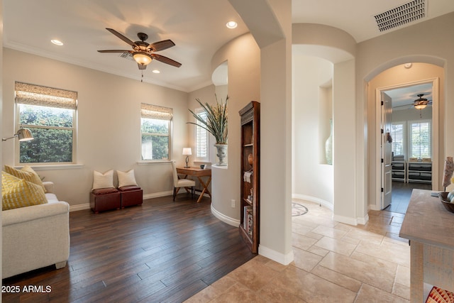1617 E Copper Holw, Queen Creek, AZ 85140 - living area with a ceiling fan, arched walkways, plenty of natural light, baseboards, and recessed lighting