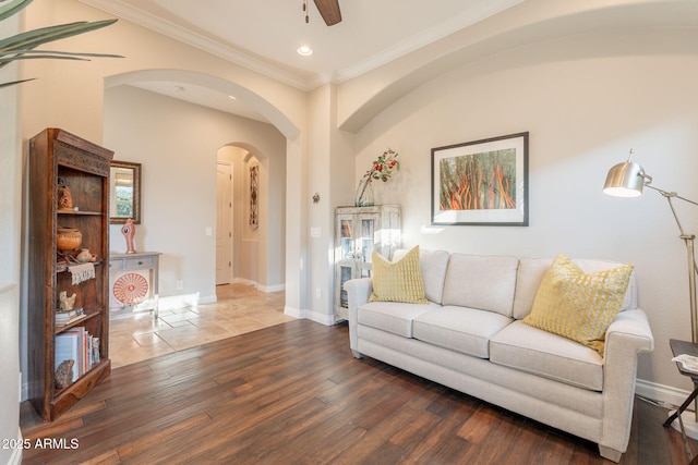1617 E Copper Holw, Queen Creek, AZ 85140 - living room with arched walkways, crown molding, baseboards, recessed lighting, and wood finished floors