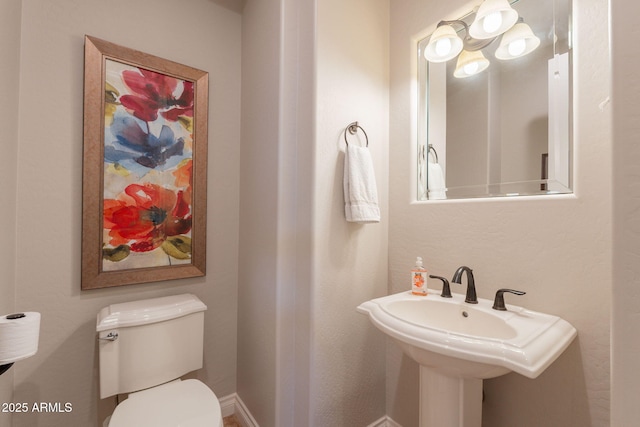 1617 E Copper Holw, Queen Creek, AZ 85140 - bathroom featuring toilet, a sink, and baseboards