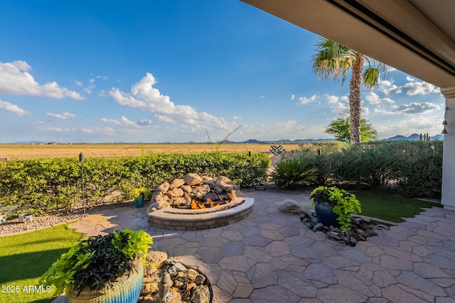 1617 E Copper Holw, Queen Creek, AZ 85140 - view of patio featuring a fire pit, a view of rural / pastoral area, and a mountain view