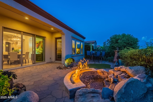 1617 E Copper Holw, Queen Creek, AZ 85140 - view of patio / terrace with a fire pit and outdoor dining area
