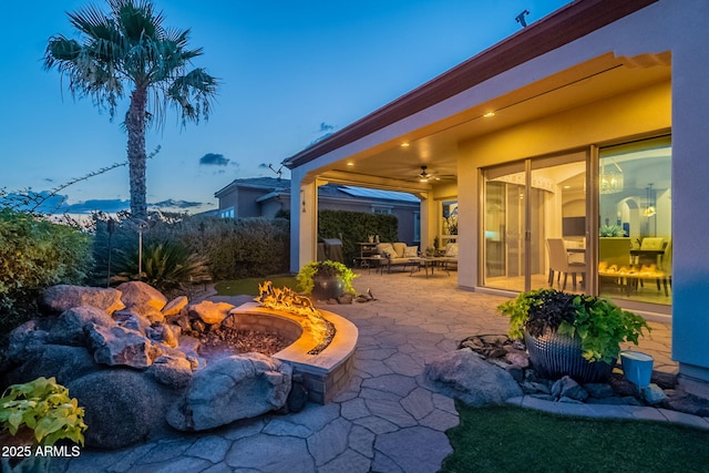 1617 E Copper Holw, Queen Creek, AZ 85140 - view of patio with ceiling fan and an outdoor living space with a fire pit
