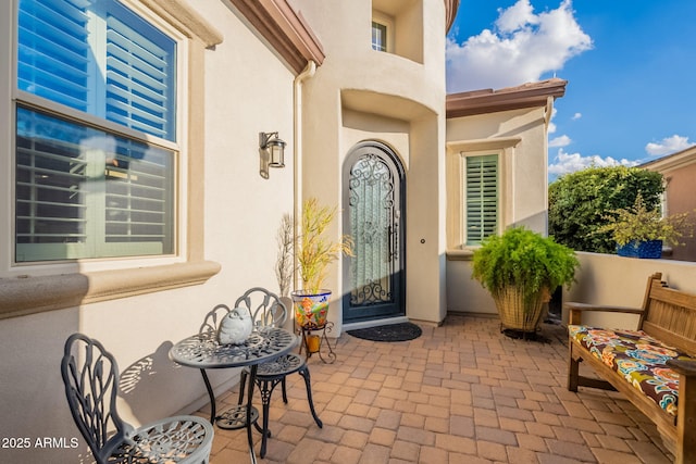 1617 E Copper Holw, Queen Creek, AZ 85140 - property entrance with a patio area and stucco siding