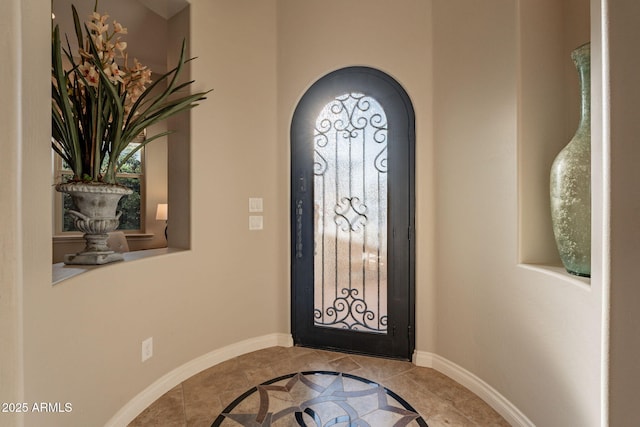 1617 E Copper Holw, Queen Creek, AZ 85140 - foyer with inlaid floor details, arched walkways, and baseboards