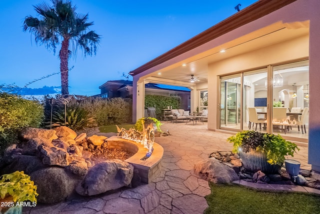 1617 E Copper Holw, Queen Creek, AZ 85140 - view of patio / terrace with a fire pit and a ceiling fan