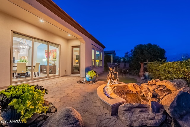 1617 E Copper Holw, Queen Creek, AZ 85140 - patio at night featuring a patio area