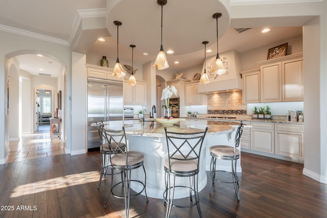 1617 E Copper Holw, Queen Creek, AZ 85140 - kitchen with arched walkways, appliances with stainless steel finishes, ornamental molding, backsplash, and light stone counters