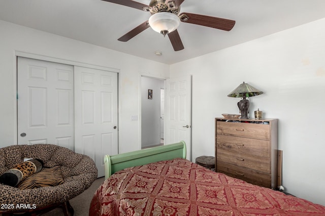 carpeted bedroom with a closet and ceiling fan