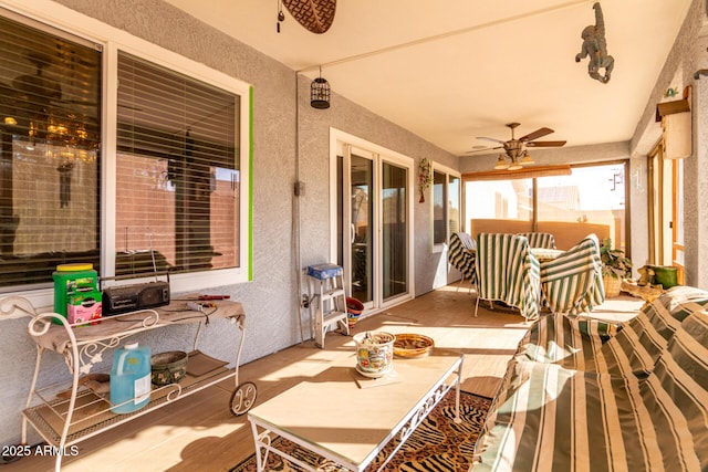 sunroom with ceiling fan