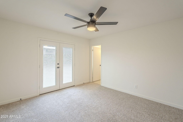 empty room with a healthy amount of sunlight, baseboards, french doors, and light colored carpet