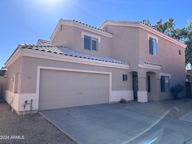 mediterranean / spanish-style home featuring a garage