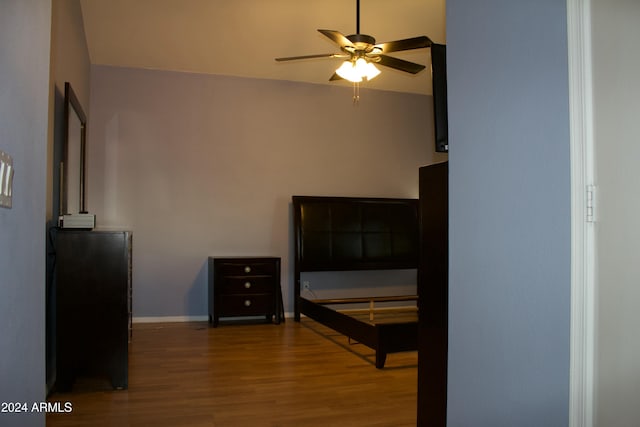 bedroom with hardwood / wood-style flooring and ceiling fan