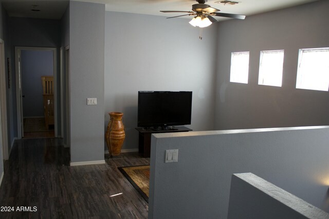 interior space with dark hardwood / wood-style floors and ceiling fan