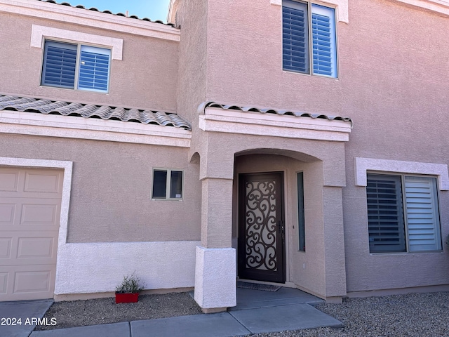 entrance to property featuring a garage