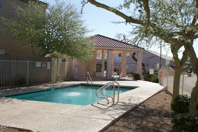 view of swimming pool with a patio area