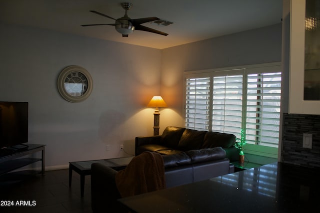 living room featuring tile patterned flooring and ceiling fan