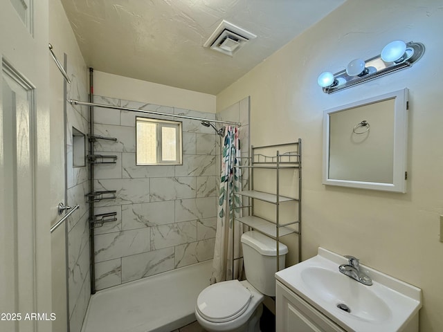 bathroom featuring a shower with curtain, vanity, and toilet