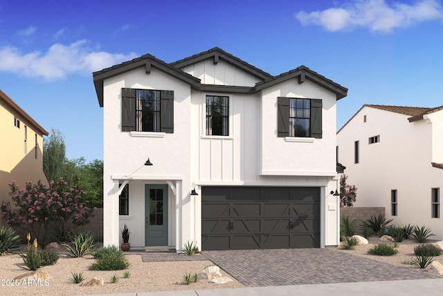 modern farmhouse featuring board and batten siding, decorative driveway, a garage, and stucco siding