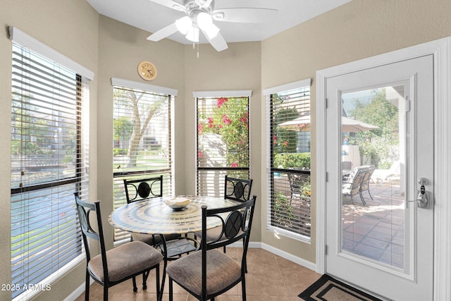 sunroom / solarium with ceiling fan