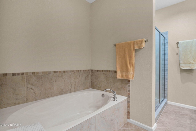 bathroom featuring separate shower and tub and tile patterned flooring