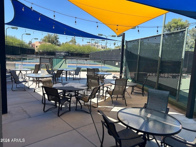 view of patio / terrace with tennis court