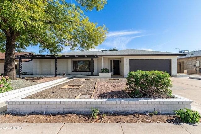 ranch-style home with driveway and an attached garage