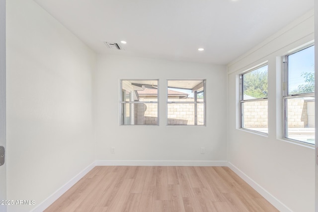 unfurnished room featuring recessed lighting, baseboards, visible vents, and light wood finished floors