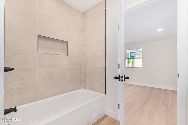 full bathroom with baseboards and wood finished floors