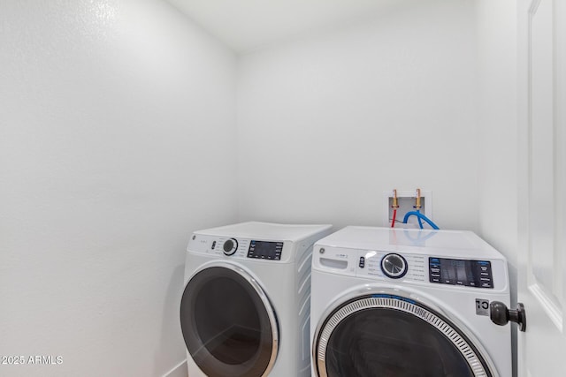 laundry room featuring laundry area and separate washer and dryer