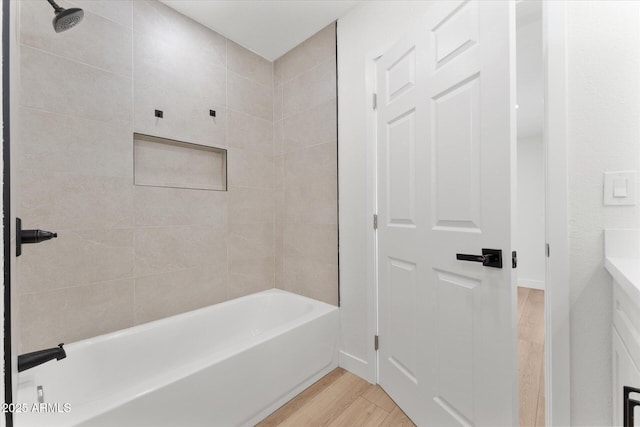 8419 N 51st Dr, Glendale, AZ 85302 - bathroom featuring vanity, shower / bathtub combination, and wood finished floors