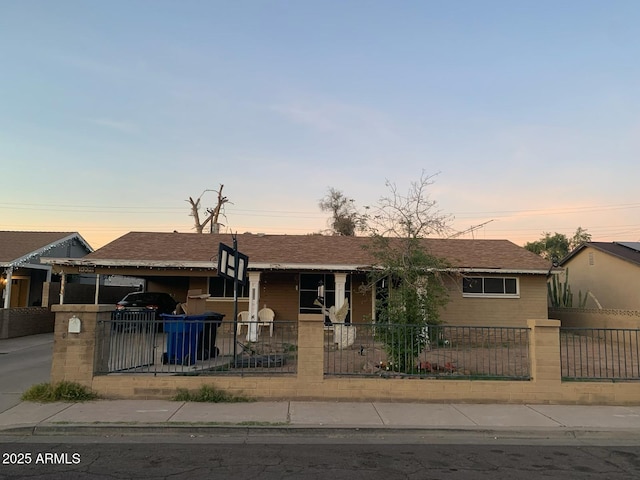 view of front of property featuring a carport