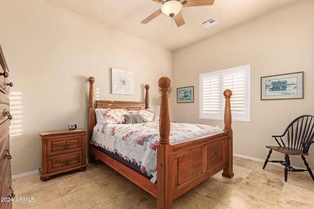 bedroom featuring a ceiling fan, visible vents, and baseboards