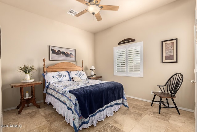 bedroom featuring a ceiling fan, visible vents, and baseboards