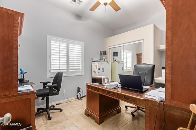 office area featuring light tile patterned floors, baseboards, visible vents, and a ceiling fan