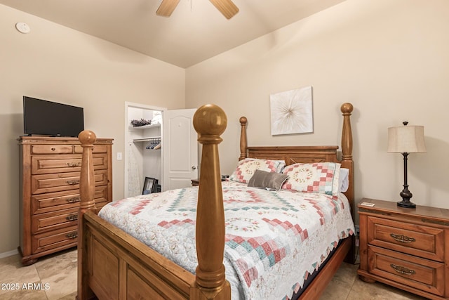 bedroom with ceiling fan, a walk in closet, and a closet