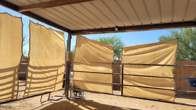 view of gate featuring fence