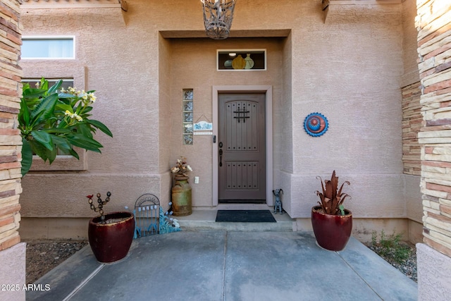 doorway to property with stucco siding