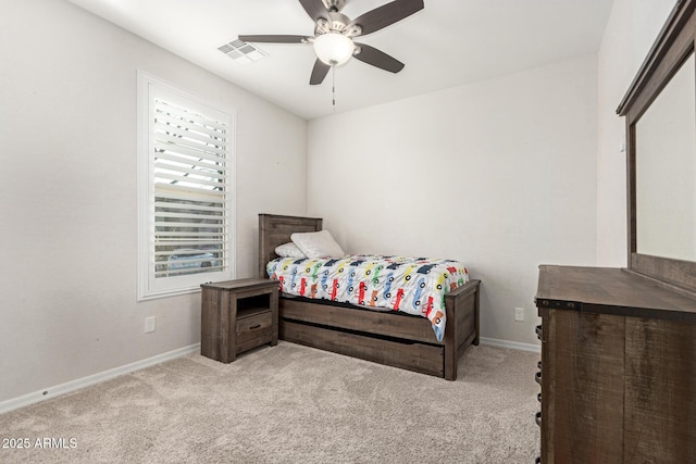 bedroom featuring light colored carpet and ceiling fan