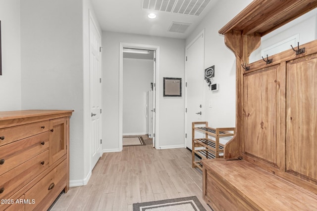 mudroom with light hardwood / wood-style floors