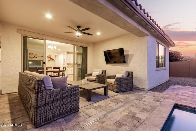 view of patio with an outdoor living space and ceiling fan