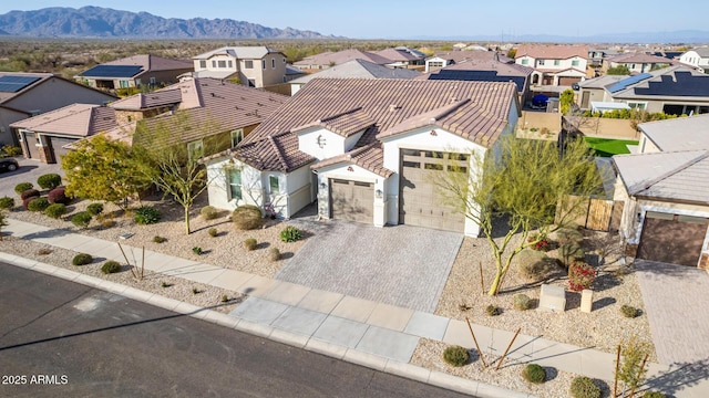 birds eye view of property with a mountain view