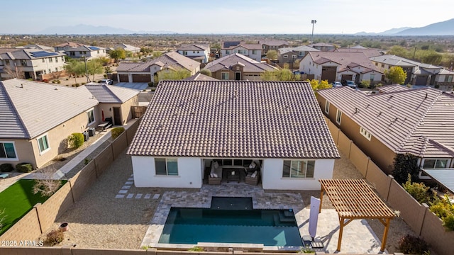 birds eye view of property with a mountain view