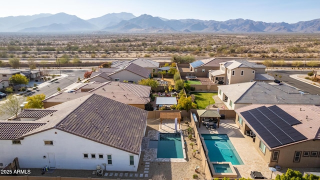 birds eye view of property with a mountain view