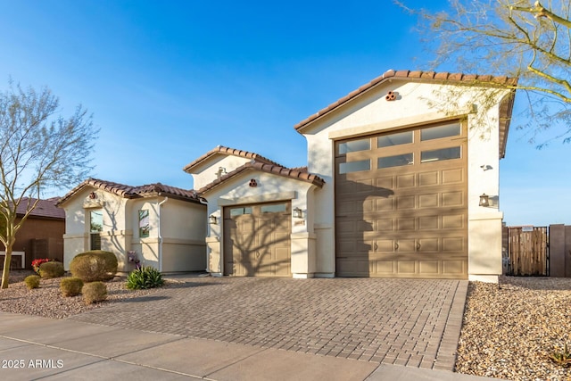 mediterranean / spanish-style house featuring a garage