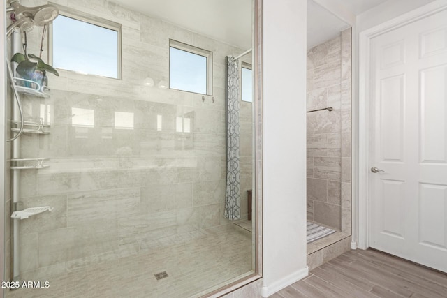 bathroom with a shower with curtain and hardwood / wood-style flooring